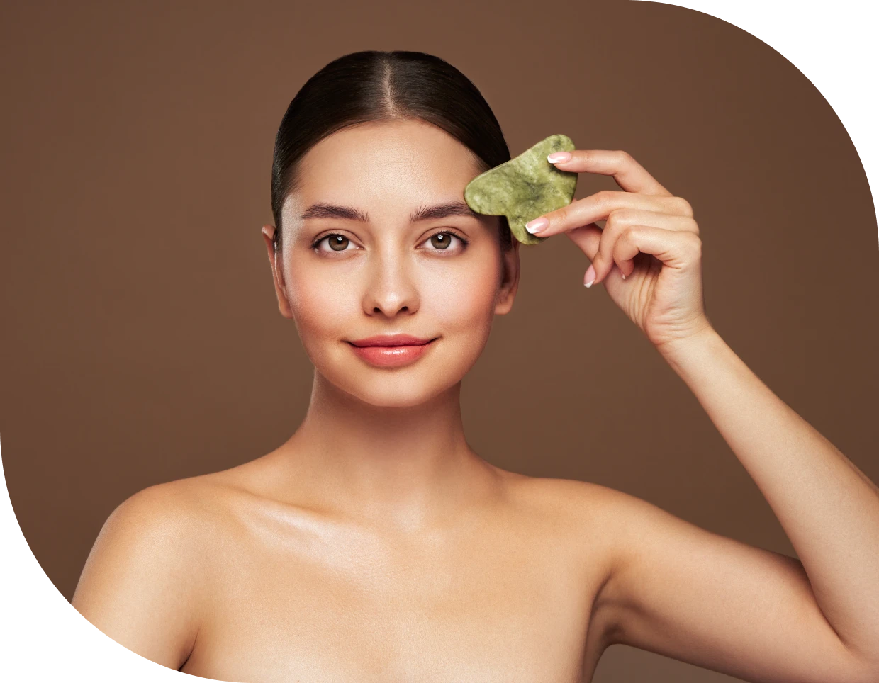 Relaxing facial massage with jade stone
